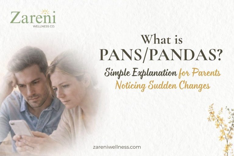 Concerned parents looking at a phone together while researching sudden behavioral changes related to PANS/PANDAS.